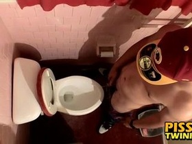 Ultra-cute twink flops out his dick and pees in the toilet cup
